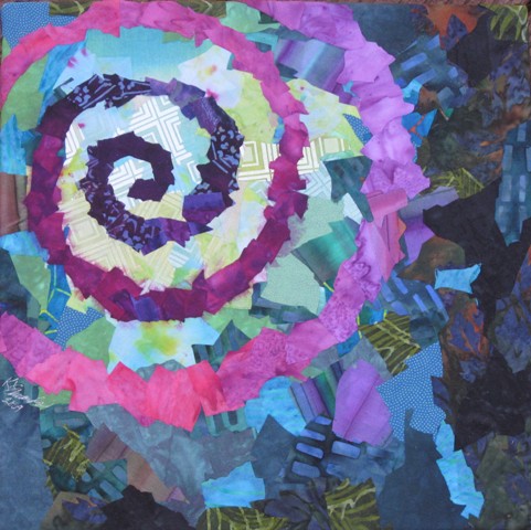 Image- purple spiral on blue background